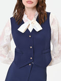 Gilet blu con bottoni gioiello