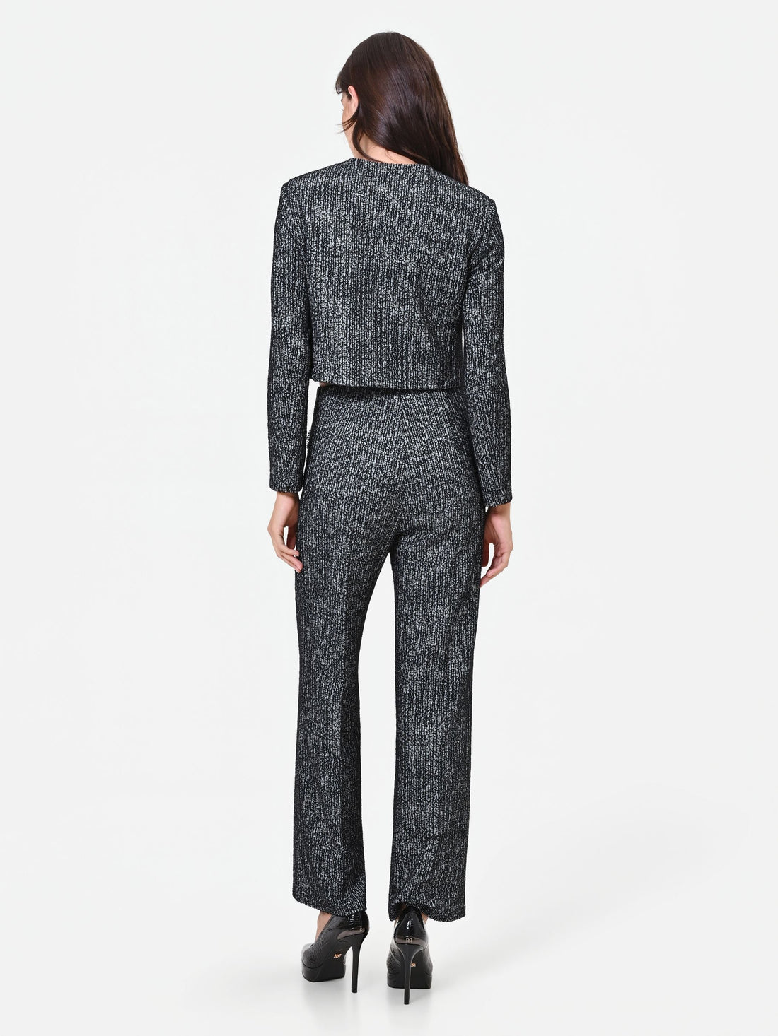 Pantalone nero in bouclé con tasche a toppa