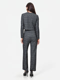Pantalone nero in bouclé con tasche a toppa