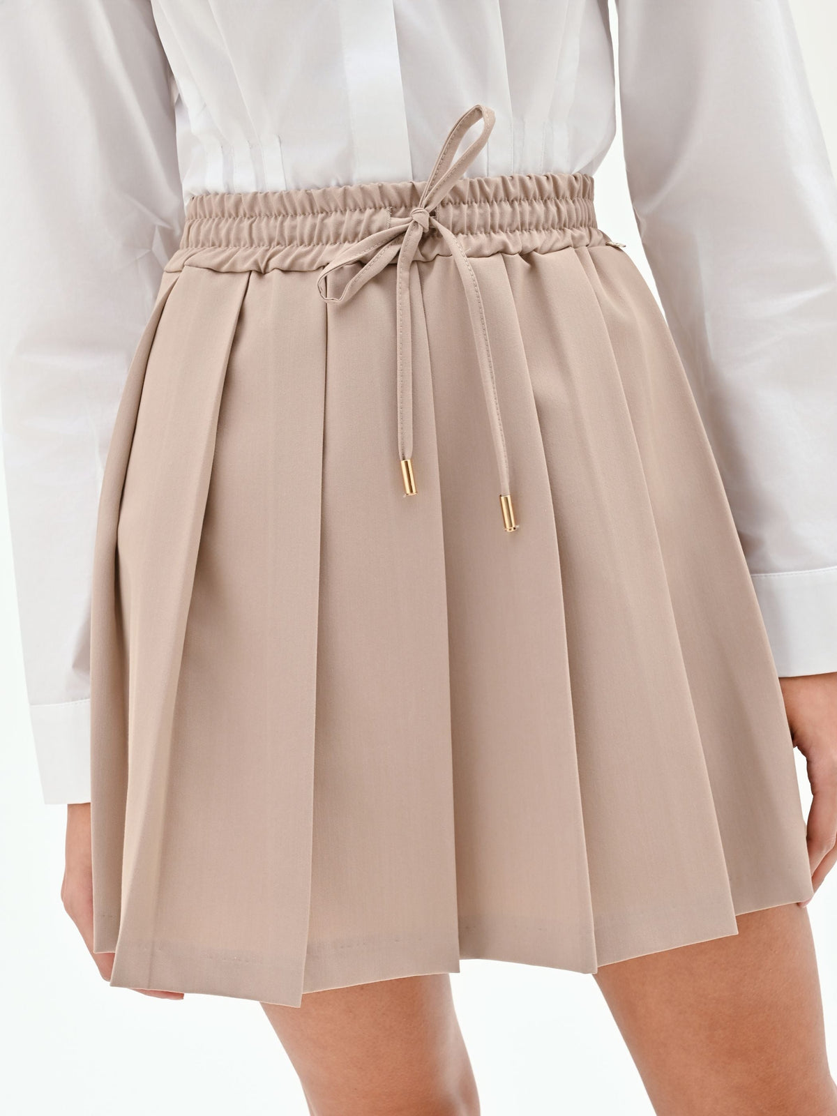 Minigonna a pieghe tortora beige