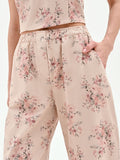 Pantalone rosa in denim stampa floreale