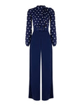 Tuta blu con blusa a pois e collo foulard