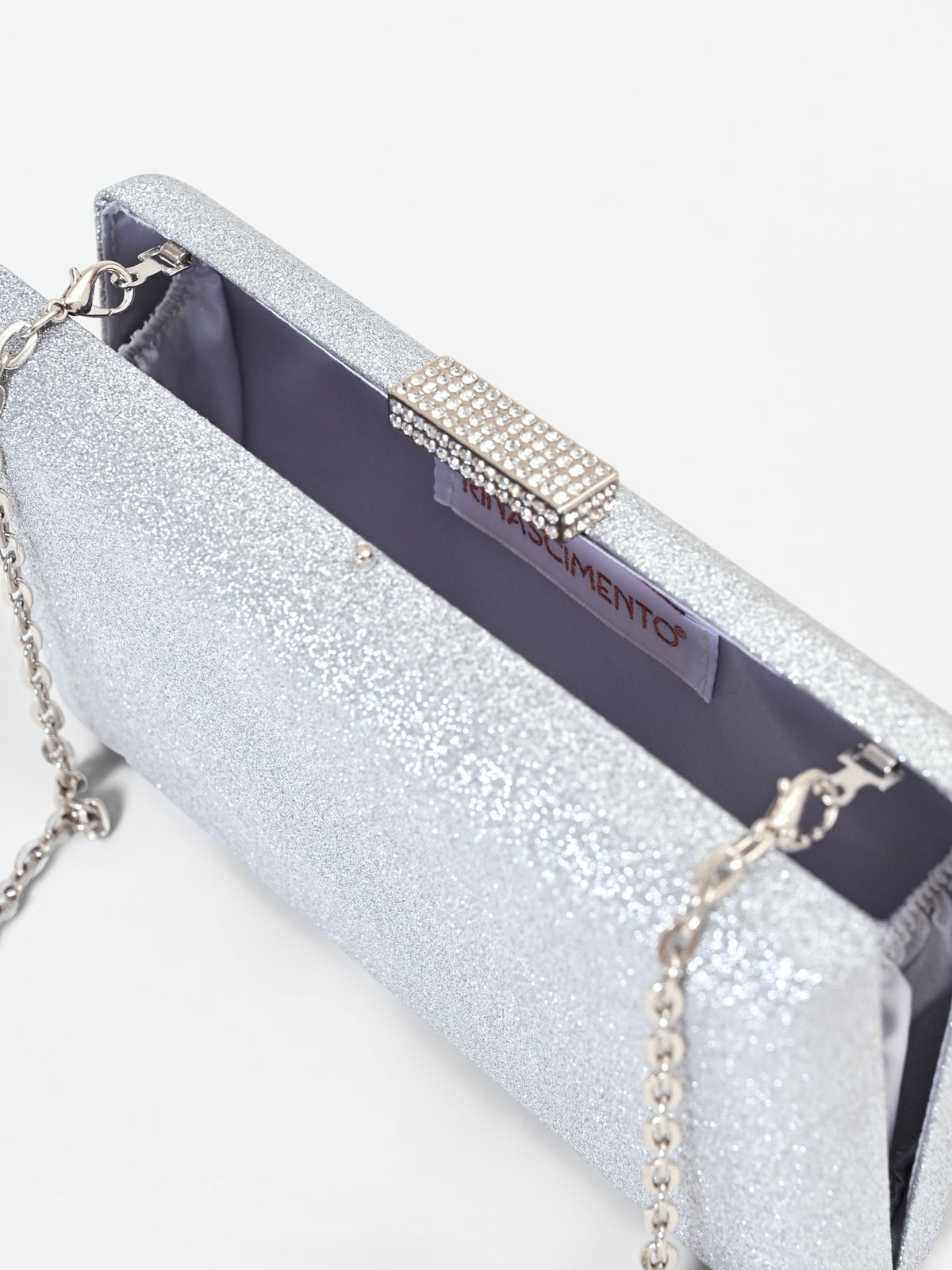 Borsa clutch argento con applicazione gioiello