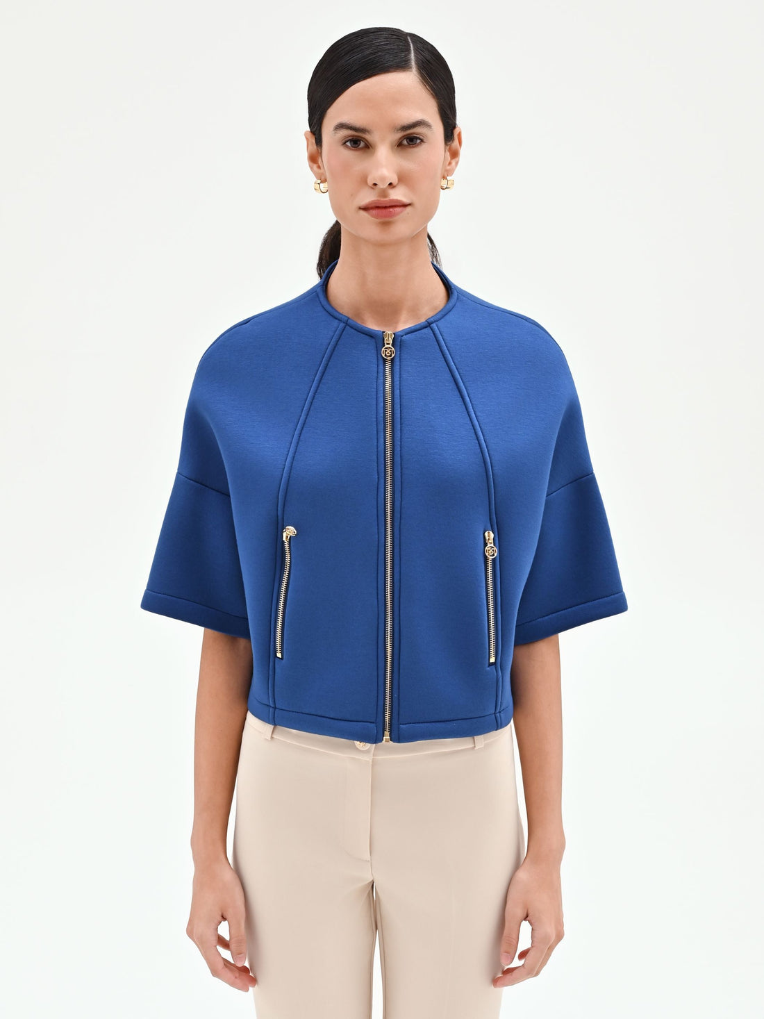 Capospalla cropped blu brillante con zip dorate