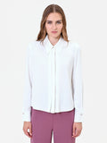 Camicia bianca con bottone gioiello