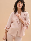 Giacca blazer rosa con fiocco sulla manica