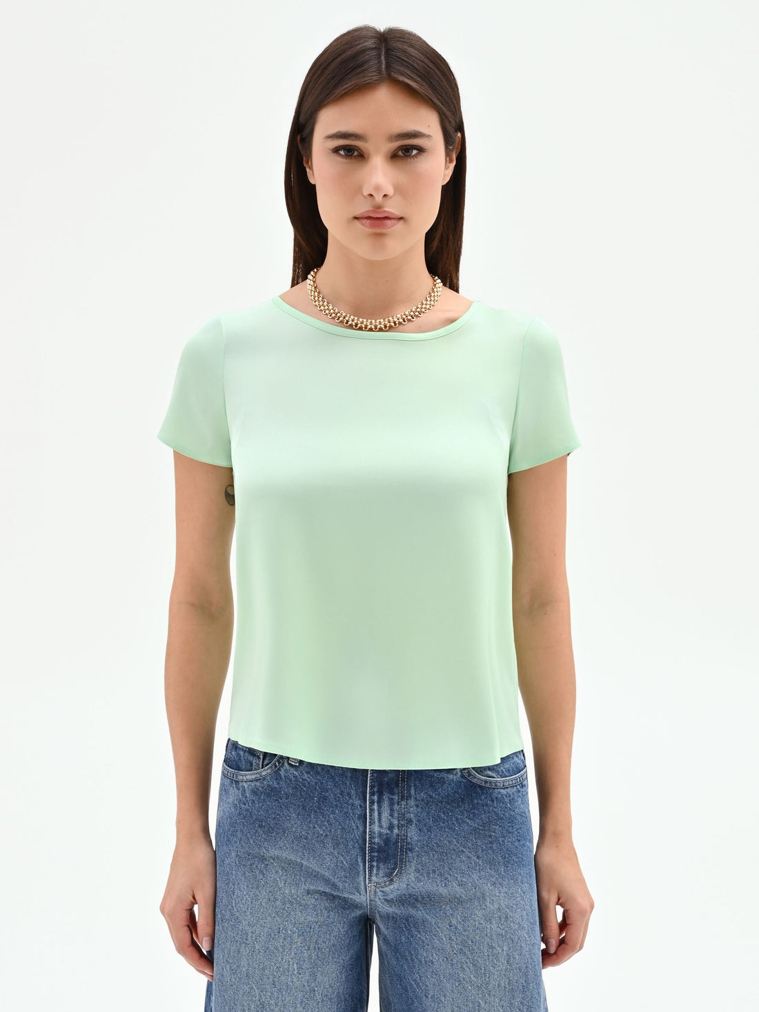 Blusa verde menta in tessuto fluido