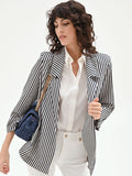 Giacca bianca a righe blu