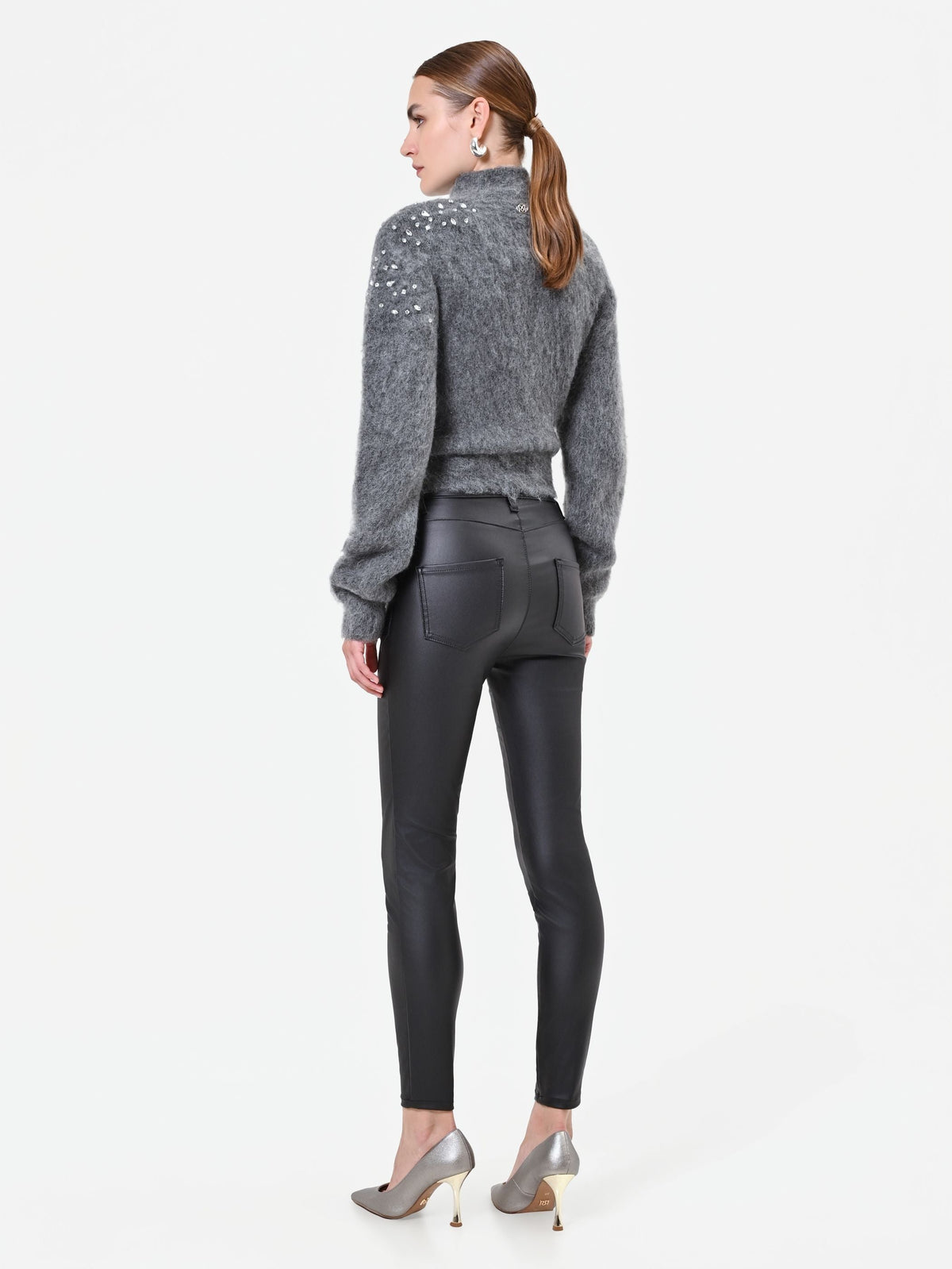 Leggings neri in similpelle con zip frontale