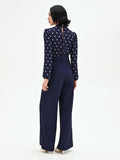 Tuta blu con blusa a pois e collo foulard