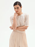 Crop top beige chiaro con paillettes