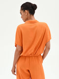 Camicia arancione in lino con nodo