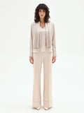 Blusa beige chiaro con foulard plissettato