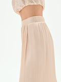 Pantalone a palazzo beige chiaro in raso cangiante