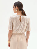 Crop top beige chiaro con paillettes